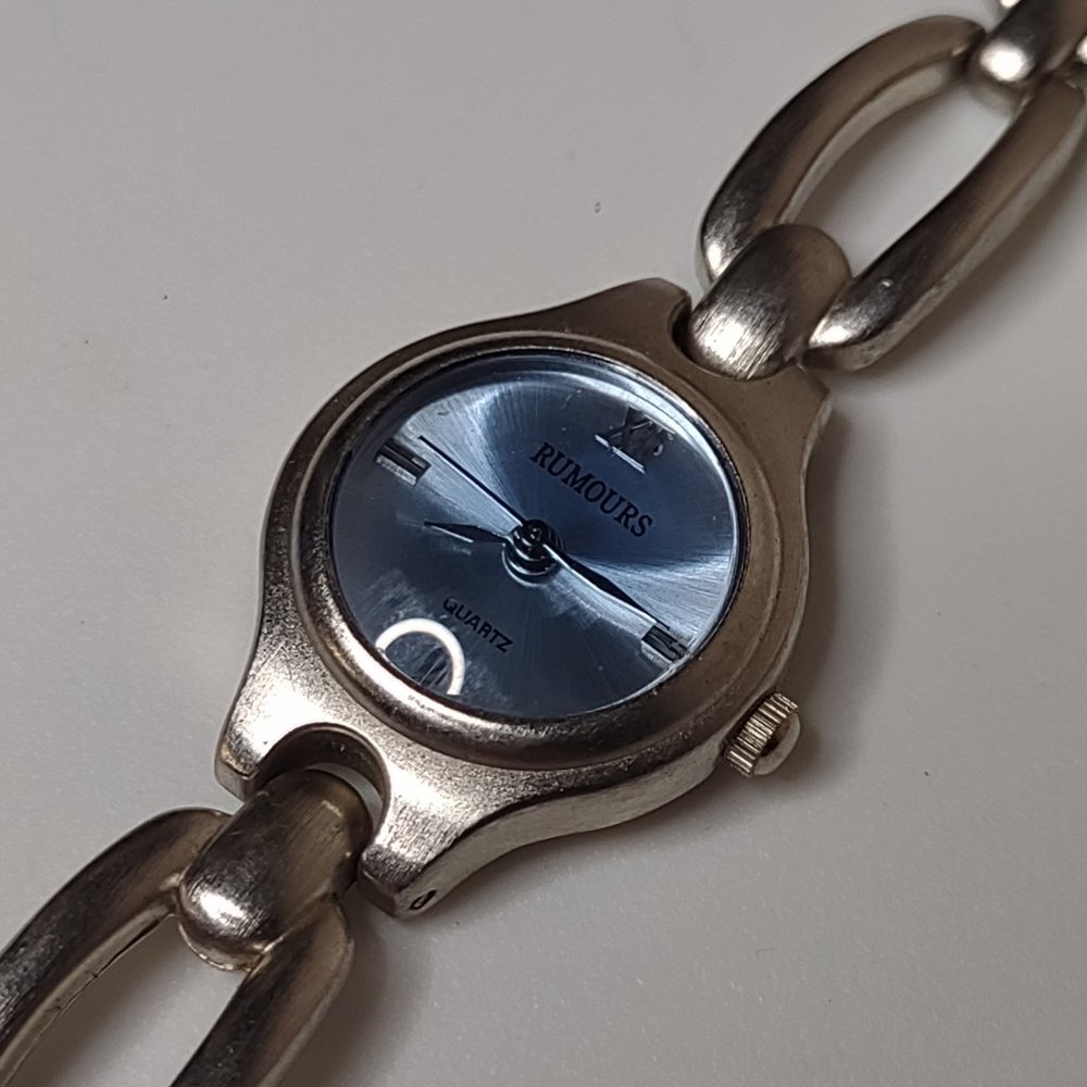 Silver Tone Metal And Blue Rumours Watch